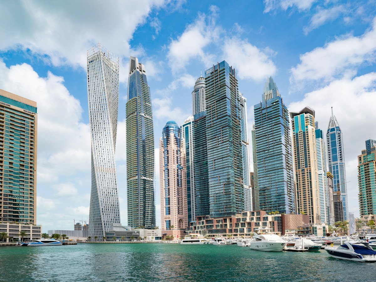 Boat on the water in front of the Dubai skyline