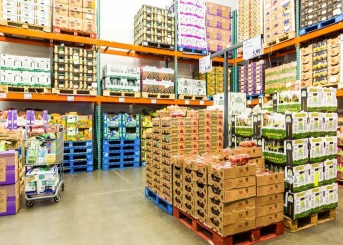 Pallets of packaged food stacked in a wholesale warehouse